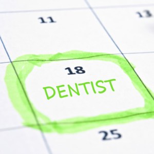 calendar with a  date circled and written Dentist on it