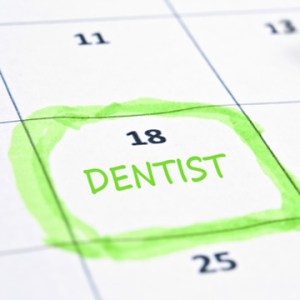 calendar with a date circled and written Dentist on it